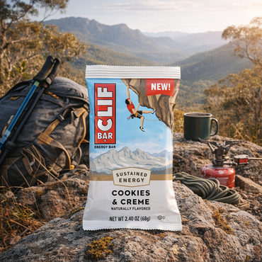 CLIF Bar cookies and cream energy bar over an Australian hiking scene
